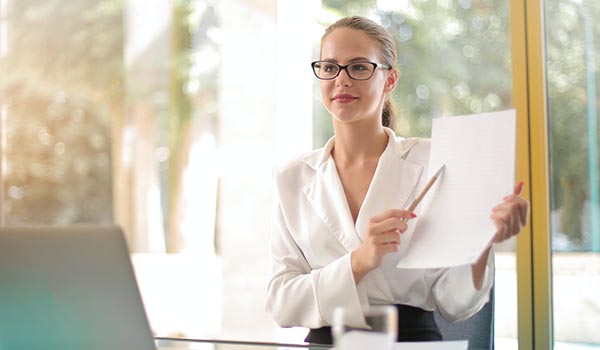 confident business woman pointing out a detail in a business document